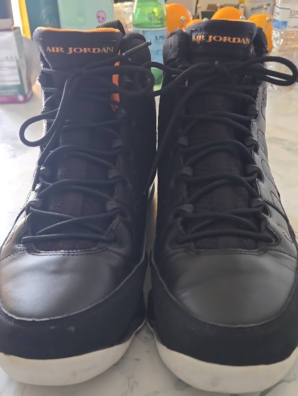Jordan Black High-Top Sneakers with Orange Logo